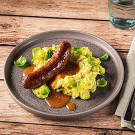 Purée aux poireaux et saucisse de bœuf au curry au jus de veau fumé